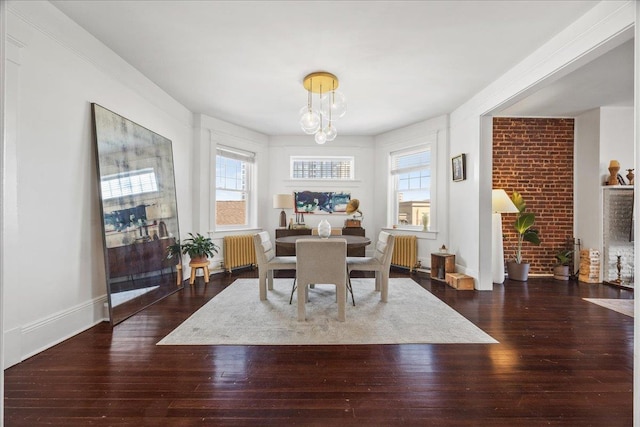 27 Locust Ave Unit 4N, New Rochelle, NY 10801 - dining room with radiator heating unit, a chandelier, and wood-type flooring