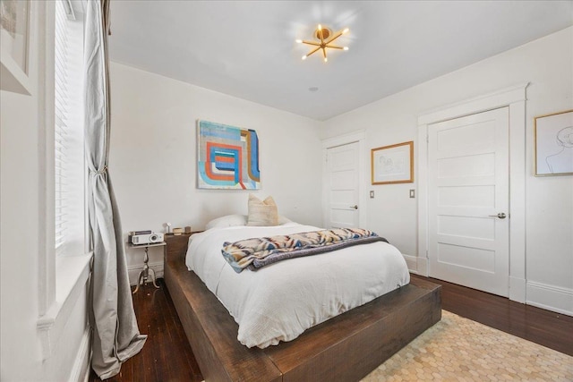 27 Locust Ave Unit 4N, New Rochelle, NY 10801 - bedroom with dark wood-style floors and baseboards