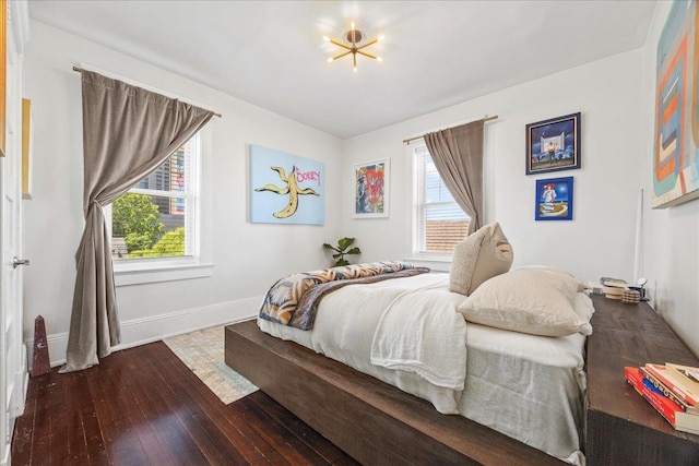 27 Locust Ave Unit 4N, New Rochelle, NY 10801 - bedroom featuring wood-type flooring, multiple windows, and baseboards