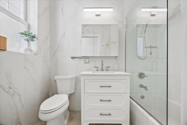27 Locust Ave Unit 4N, New Rochelle, NY 10801 - bathroom with toilet, vanity, bathtub / shower combination, and tile walls