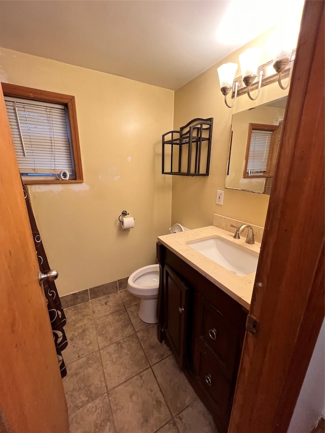 6 Farmingdale Ln, Bloomingburg, NY 12721 - half bathroom with vanity, toilet, baseboards, and tile patterned floors