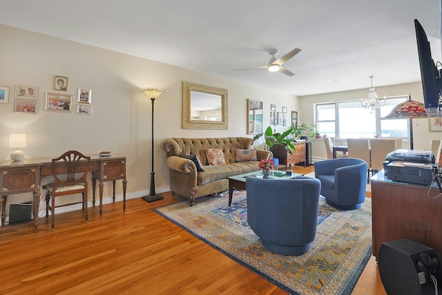 103 Gedney St Unit 2N, Nyack, NY 10960 - living area with light wood-type flooring, ceiling fan, a chandelier, and baseboards