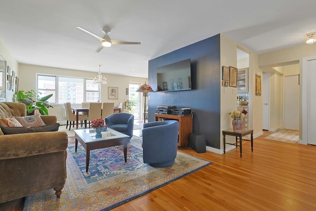 103 Gedney St Unit 2N, Nyack, NY 10960 - living area featuring wood finished floors, ceiling fan, a chandelier, and baseboards