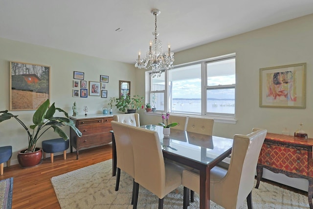103 Gedney St Unit 2N, Nyack, NY 10960 - dining space with a chandelier and wood finished floors