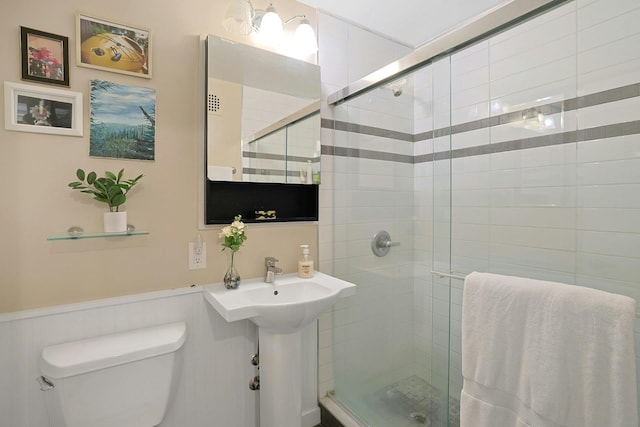 103 Gedney St Unit 2N, Nyack, NY 10960 - full bath with toilet, a stall shower, and a wainscoted wall
