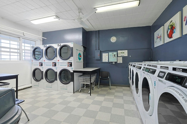 103 Gedney St Unit 2N, Nyack, NY 10960 - community laundry with stacked washing machine and dryer, tile patterned floors, independent washer and dryer, and baseboards