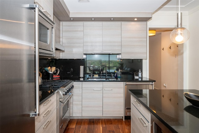 5 Renaissance Sq Unit 17B, White Plains, NY 10601 - kitchen featuring appliances with stainless steel finishes, a sink, modern cabinets, and dark wood finished floors
