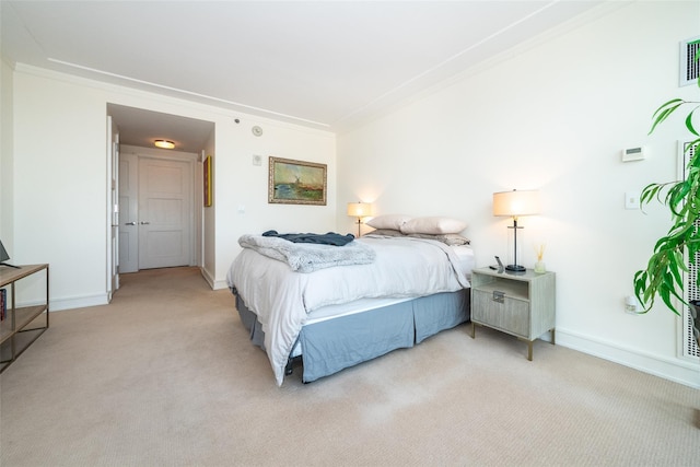 5 Renaissance Sq Unit 17B, White Plains, NY 10601 - bedroom with light carpet, ornamental molding, and baseboards