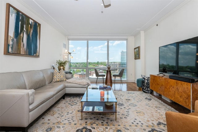 5 Renaissance Sq Unit 17B, White Plains, NY 10601 - living area featuring a ceiling fan, wood finished floors, a wall of windows, and crown molding
