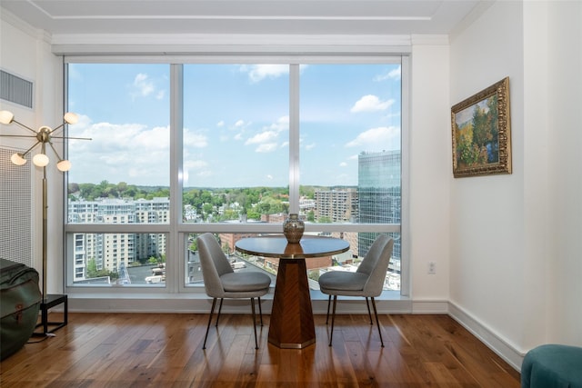5 Renaissance Sq Unit 17B, White Plains, NY 10601 - dining room with hardwood / wood-style floors, healthy amount of natural light, ornamental molding, a city view, and baseboards