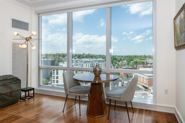 5 Renaissance Sq Unit 17B, White Plains, NY 10601 - dining room with hardwood / wood-style floors, crown molding, and a view of city