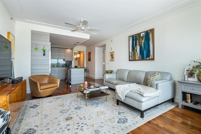 5 Renaissance Sq Unit 17B, White Plains, NY 10601 - living area featuring crown molding, wood finished floors, a ceiling fan, and baseboards
