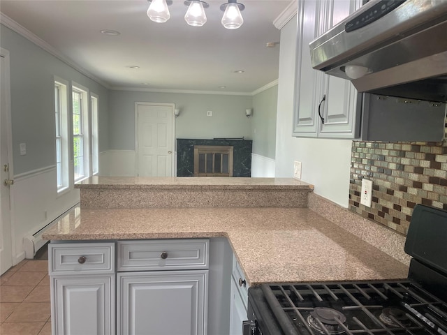 10 Kirby Ln, Central Islip, NY 11722 - kitchen with black range with gas cooktop, under cabinet range hood, a peninsula, backsplash, and baseboard heating