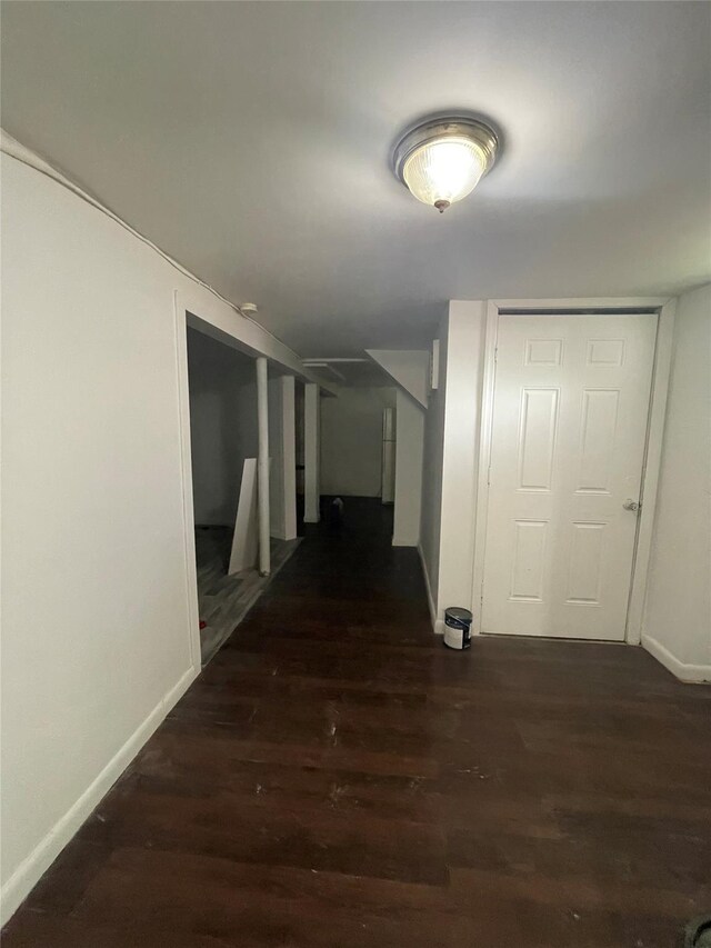 10 Kirby Ln, Central Islip, NY 11722 - hall featuring baseboards and dark wood-style flooring