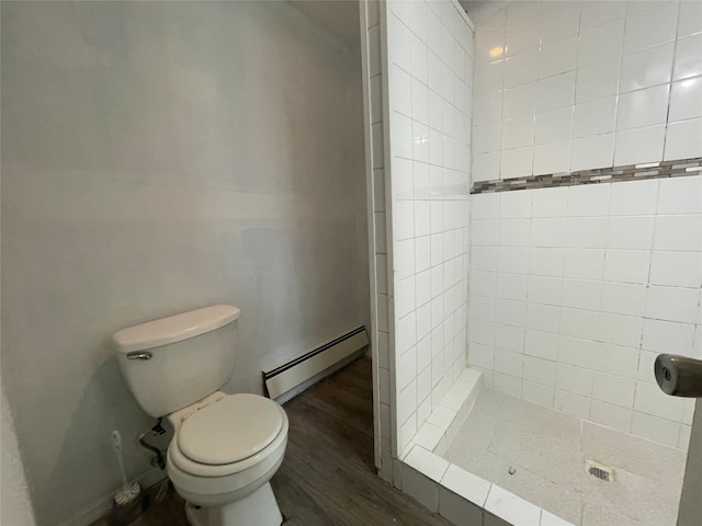 10 Kirby Ln, Central Islip, NY 11722 - full bathroom with a baseboard radiator, a shower stall, wood finished floors, and toilet