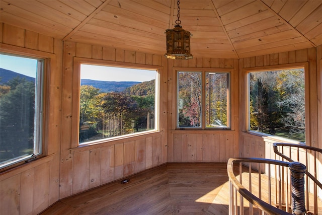 390 Erpf Rd, Arkville, NY 12406 - unfurnished sunroom with wooden walls, wooden ceiling, a mountain view, and wood finished floors