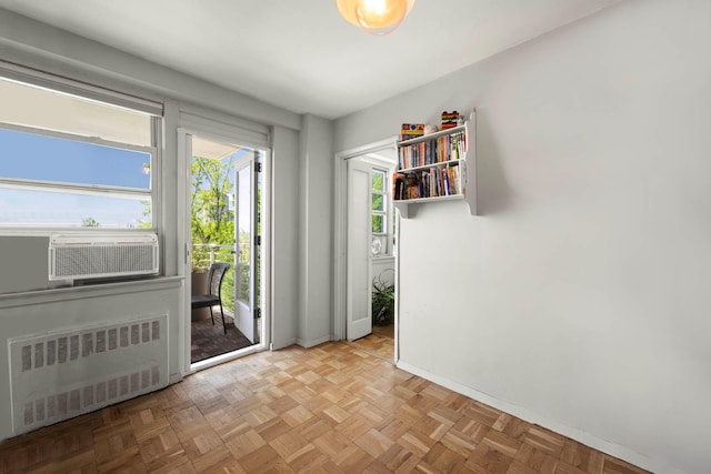 3135 Johnson Ave Unit 9A, Bronx, NY 10463 - doorway with radiator, baseboards, and cooling unit