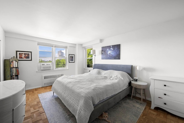 3135 Johnson Ave Unit 9A, Bronx, NY 10463 - bedroom with radiator, cooling unit, and baseboards