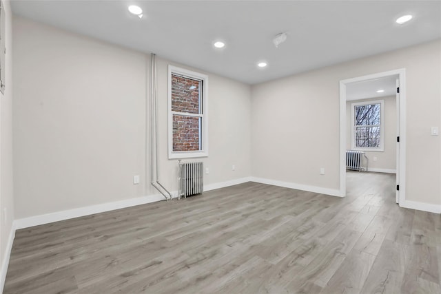 305 Union Ave, New Rochelle, NY 10801 - spare room with radiator, light wood-type flooring, recessed lighting, and baseboards