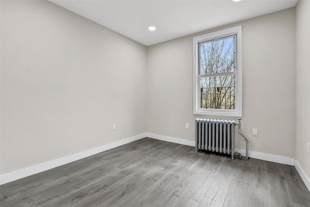 305 Union Ave, New Rochelle, NY 10801 - empty room featuring radiator heating unit, wood finished floors, baseboards, and recessed lighting