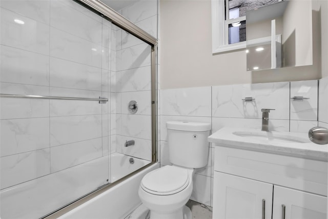305 Union Ave, New Rochelle, NY 10801 - full bathroom with enclosed tub / shower combo, vanity, toilet, and tile walls