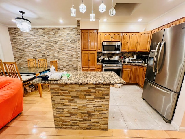 5-41 117th St, College Point, NY 11356 - kitchen featuring stainless steel appliances, crown molding, backsplash, brown cabinets, and stone counters