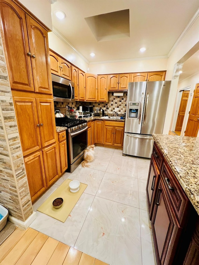 5-41 117th St, College Point, NY 11356 - kitchen with appliances with stainless steel finishes, light stone countertops, a sink, crown molding, and backsplash