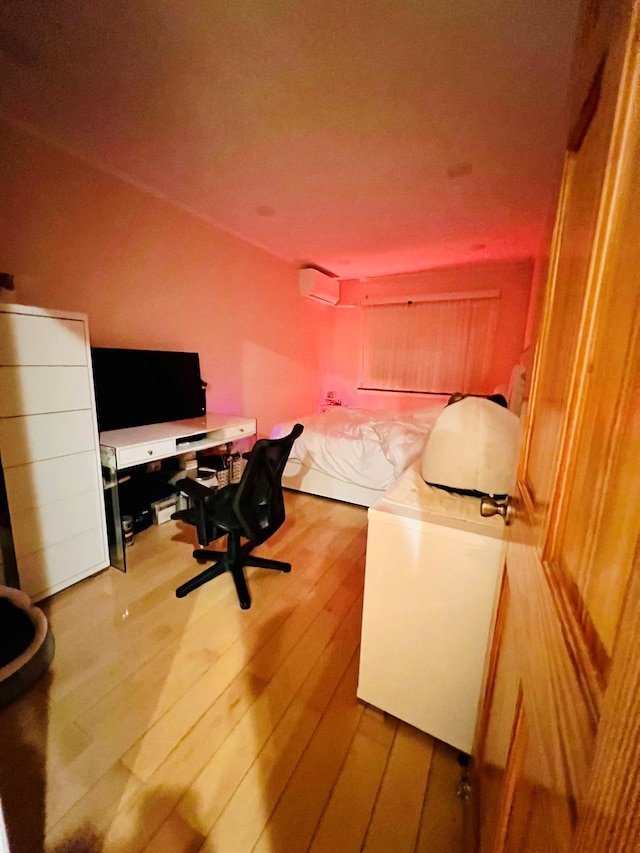 5-41 117th St, College Point, NY 11356 - bedroom featuring wood-type flooring, a desk, and a wall mounted AC