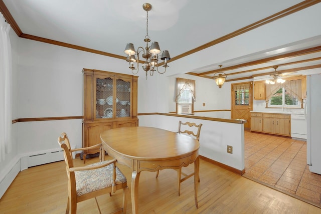 115 Fowler Ave, Yonkers, NY 10701 - dining space featuring a chandelier, light wood-style flooring, crown molding, and baseboards