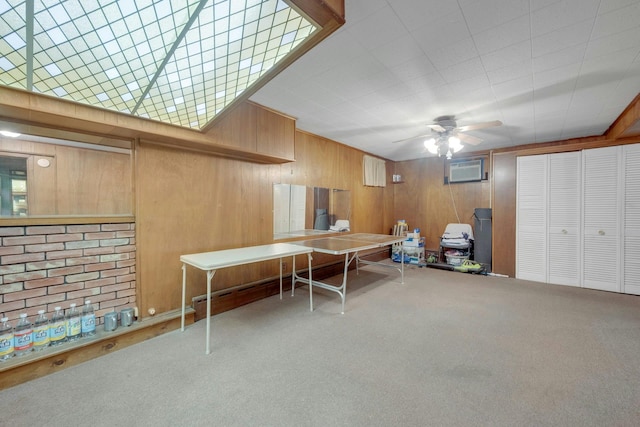 115 Fowler Ave, Yonkers, NY 10701 - game room featuring carpet, ceiling fan, wooden walls, and an AC wall unit