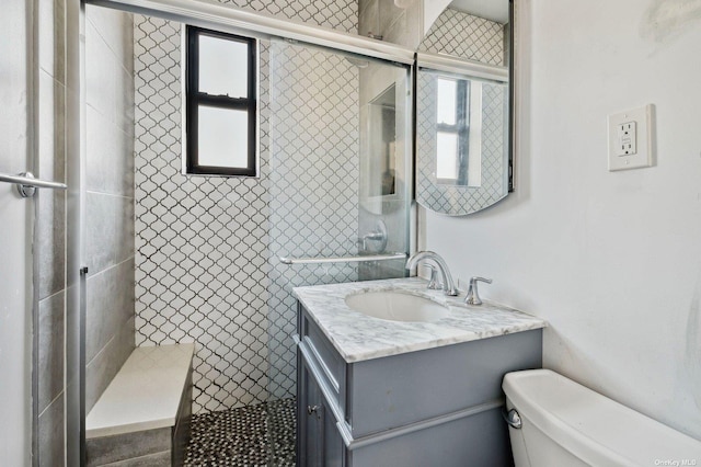 21-16 35th St Unit 5B, Astoria, NY 11105 - full bathroom featuring healthy amount of natural light, toilet, a tile shower, and vanity
