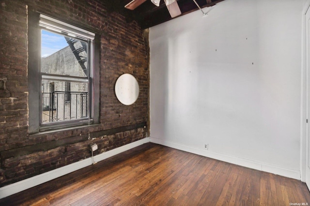 21-16 35th St Unit 5B, Astoria, NY 11105 - spare room featuring baseboards, wood-type flooring, and ceiling fan