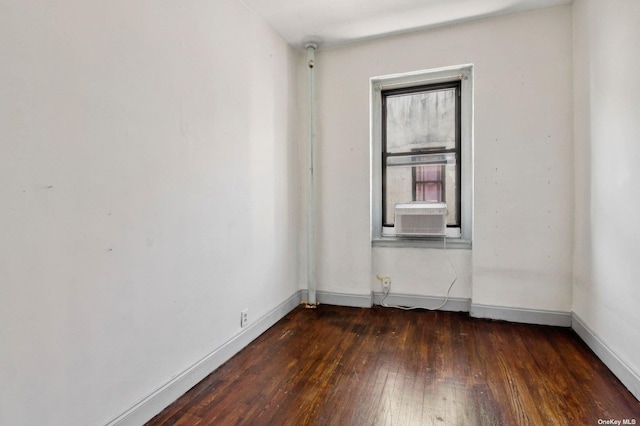 21-16 35th St Unit 5B, Astoria, NY 11105 - unfurnished room with dark wood-style flooring, cooling unit, and baseboards