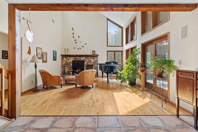 20 Old Farm Ln, Garrison, NY 10524 - living area featuring beam ceiling, wood finished floors, a fireplace, and high vaulted ceiling