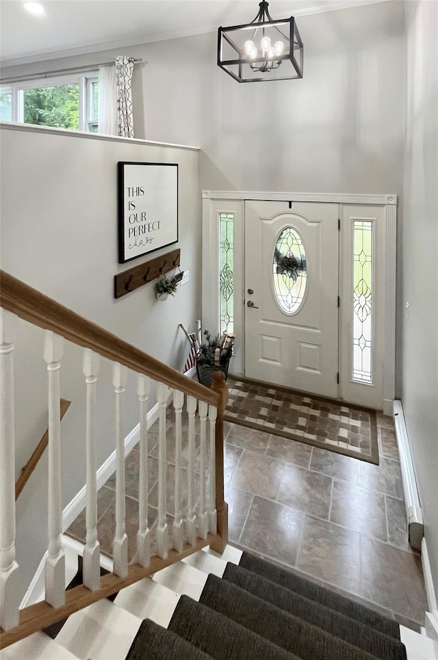 20 Shale Dr, Wappingers Falls, NY 12590 - foyer entrance featuring a high ceiling, stairs, stone tile floors, and a chandelier