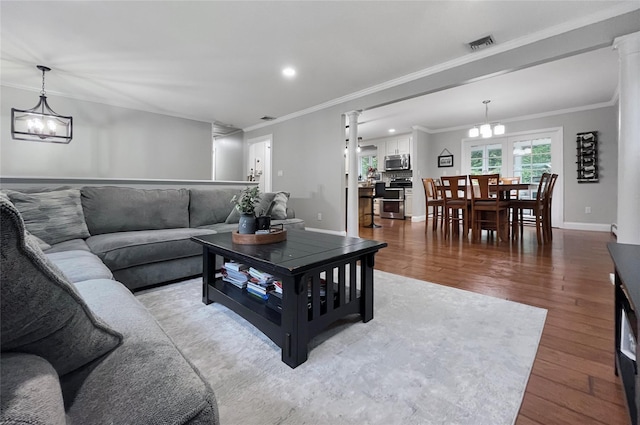 20 Shale Dr, Wappingers Falls, NY 12590 - living room with a chandelier, crown molding, wood finished floors, recessed lighting, and baseboards