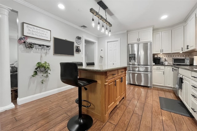 20 Shale Dr, Wappingers Falls, NY 12590 - kitchen featuring stainless steel appliances, crown molding, light wood-type flooring, white cabinets, and recessed lighting