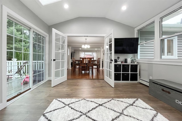 20 Shale Dr, Wappingers Falls, NY 12590 - sunroom / solarium with french doors, a baseboard heating unit, a chandelier, and vaulted ceiling