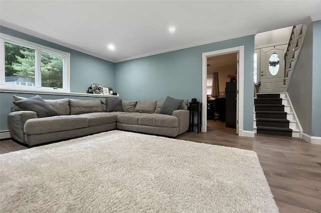 20 Shale Dr, Wappingers Falls, NY 12590 - living area with wood finished floors, ornamental molding, stairway, baseboards, and a baseboard radiator
