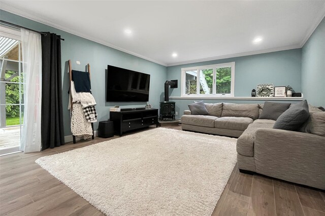 20 Shale Dr, Wappingers Falls, NY 12590 - living area featuring a wood stove, ornamental molding, wood finished floors, and recessed lighting