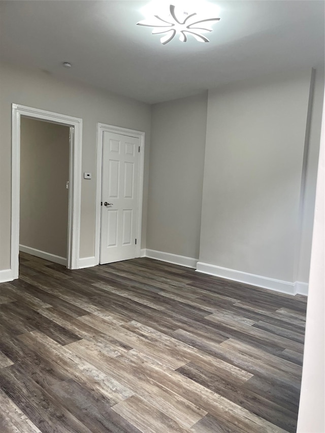 32 Moquette Row S, Yonkers, NY 10703 - unfurnished room with dark wood finished floors and baseboards
