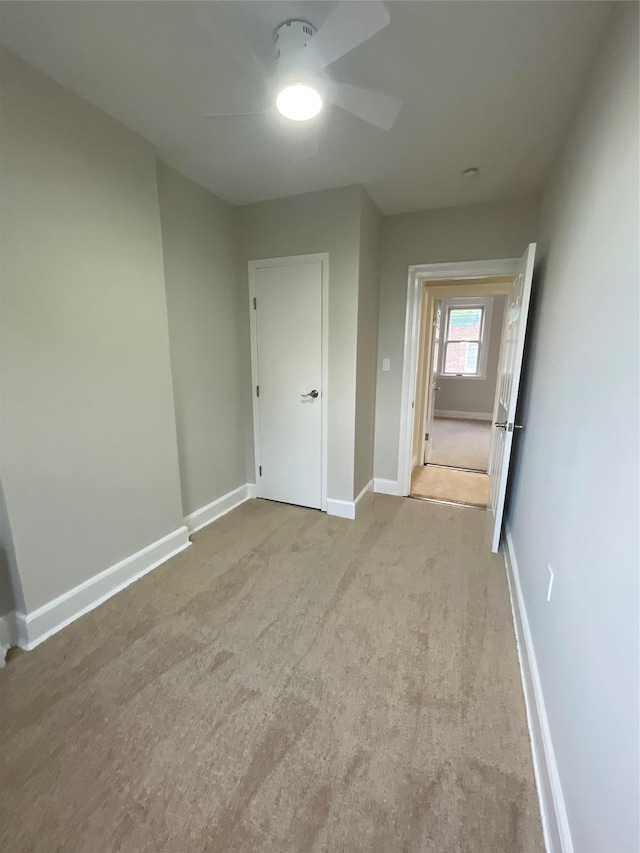 32 Moquette Row S, Yonkers, NY 10703 - unfurnished bedroom featuring baseboards, carpet floors, and a ceiling fan