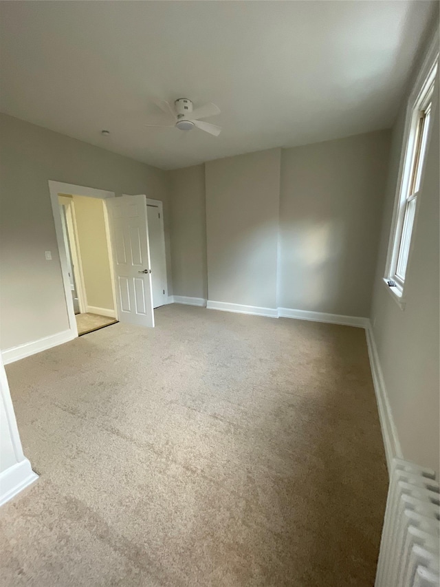 32 Moquette Row S, Yonkers, NY 10703 - carpeted spare room with a ceiling fan and baseboards