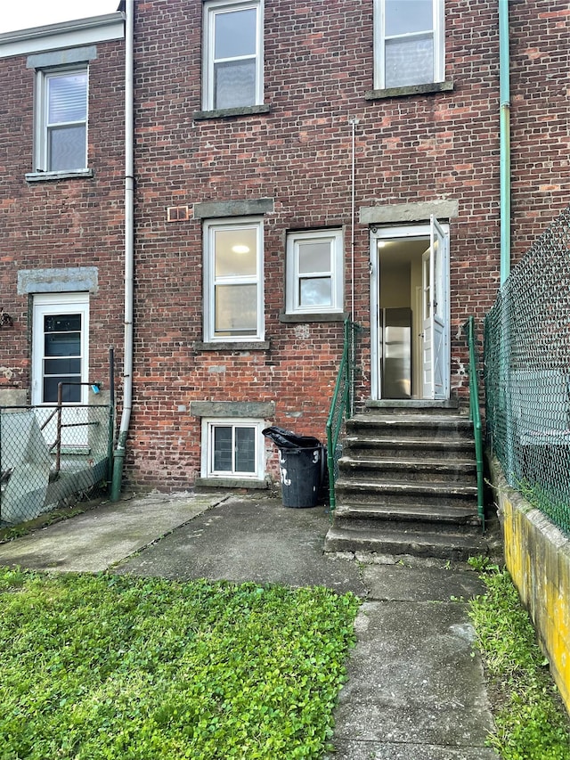 32 Moquette Row S, Yonkers, NY 10703 - rear view of property with brick siding and entry steps