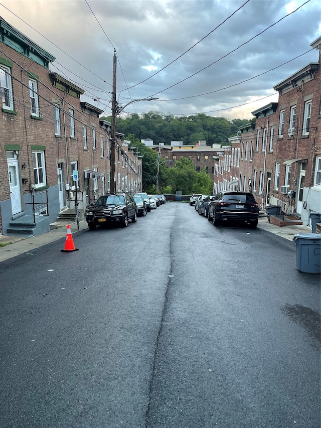32 Moquette Row S, Yonkers, NY 10703 - view of asphalt road with street lights, sidewalks, and curbs