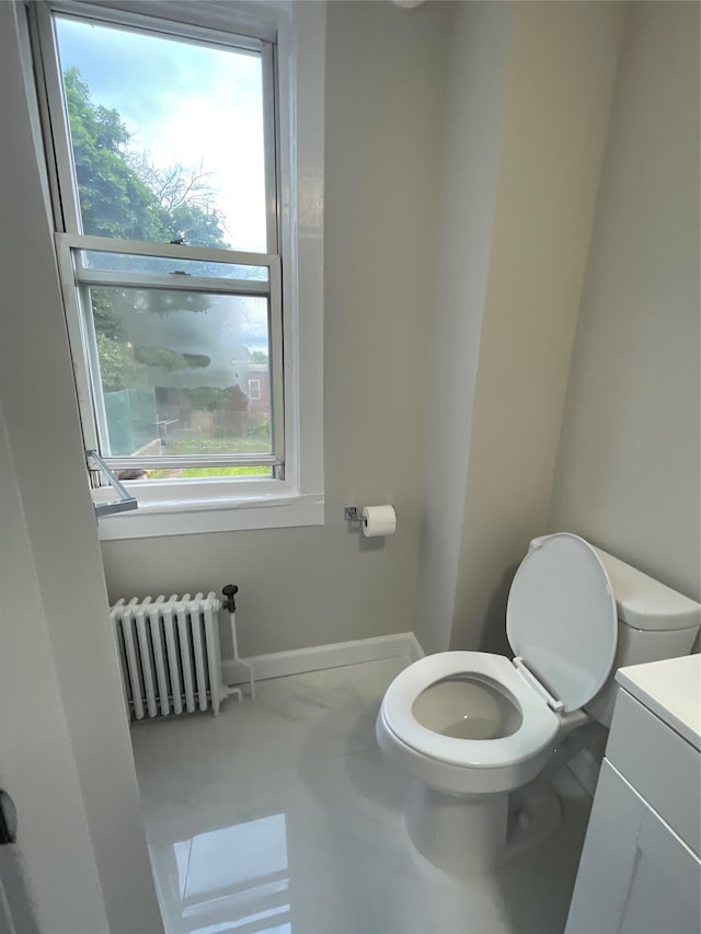 32 Moquette Row S, Yonkers, NY 10703 - bathroom with radiator heating unit, toilet, plenty of natural light, and vanity