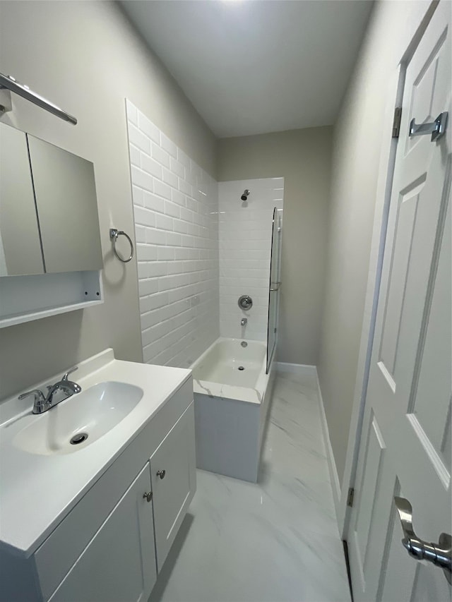 32 Moquette Row S, Yonkers, NY 10703 - full bath with marble look tiles, vanity,  shower combination, and baseboards