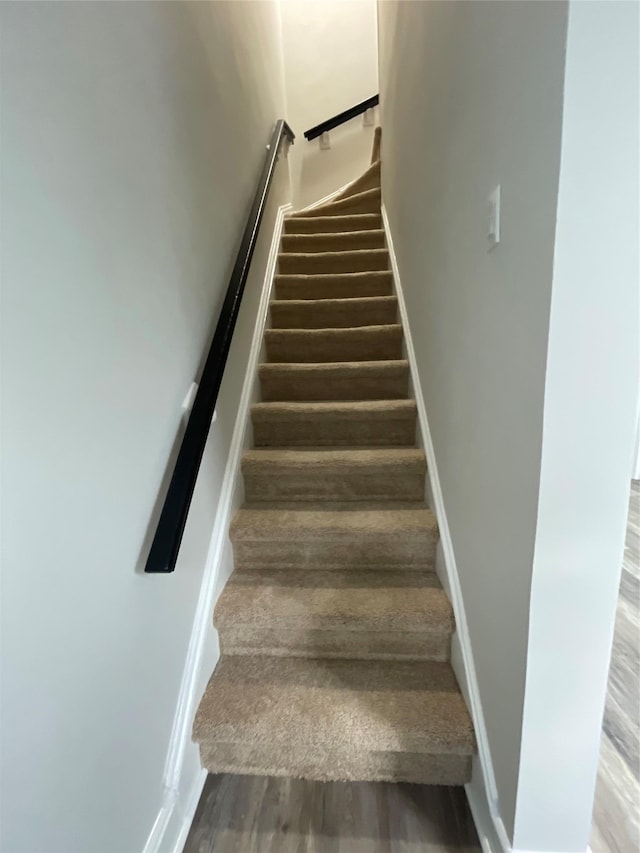32 Moquette Row S, Yonkers, NY 10703 - stairs featuring wood finished floors and baseboards