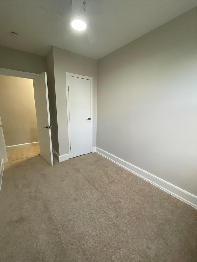 32 Moquette Row S, Yonkers, NY 10703 - unfurnished bedroom with carpet flooring, baseboards, and a ceiling fan