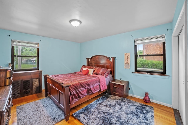35 Lawrence Dr Unit A, White Plains, NY 10603 - bedroom with multiple windows, light wood-type flooring, and baseboards